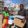Emergency supplies are delivered to people at an evacuation centre in Shefa Province in Vanuatu after Tropical cyclones Kevin and Judy left a trail of destruction across the country.