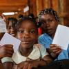 Children in Lichinga, Mozambique learn about the dangers of cholera.