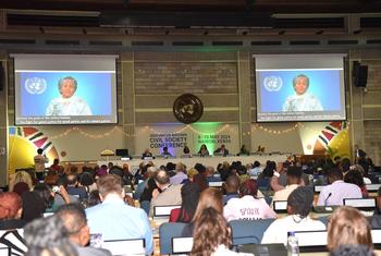 Delegates at the opening of the UN Civil Society Conference in Nairobi, Kenya. On-screen, UN Deputy Secretary-General Maina Mohammad.