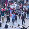 Protesters march through Kathmandu on Monday, holding signs denouncing corruption and nepotism. The protest was met with a violent crackdown that left at least 19 people dead.