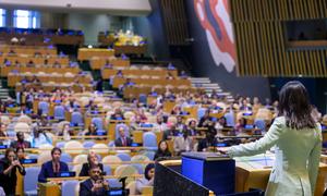 Annalena Baerbock (right), President of the 80th session of the General Assembly, takes the oath of office on the original Charter of the United Nations.