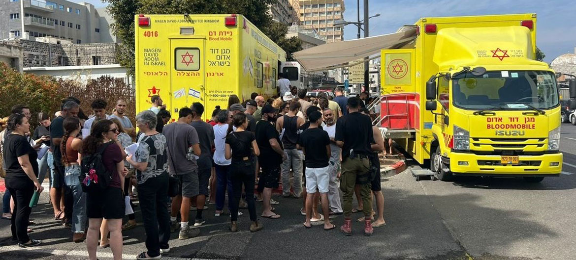 People in Israel queue to donate blood.