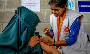 A teenage girl receives her second dose of the COVID-19 vaccine in Bhasan Char in Bangladesh.