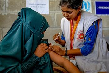 A teenage girl receives her second dose of the COVID-19 vaccine in Bhasan Char in Bangladesh.