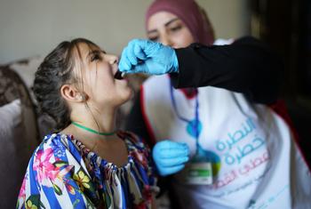 A young girl receives her measles vaccination in Lebanon.