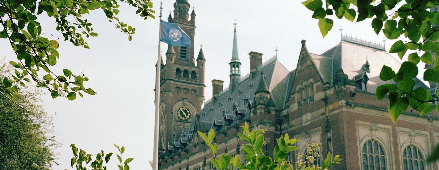 The United Nations flag flies in front of the Peace Palace, home of the International Court of Justice at The Hague.