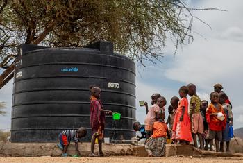 Sopel Village, Kenya, pupils of Sopel Primary School collect drinking water from a water point in the school. UNICEF has rehabilitated the solar-powered water system. 