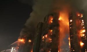 Wang Fung Court apartment complex buildings on fire in Hong Kong.