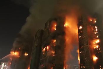 Wang Fung Court apartment complex buildings on fire in Hong Kong.