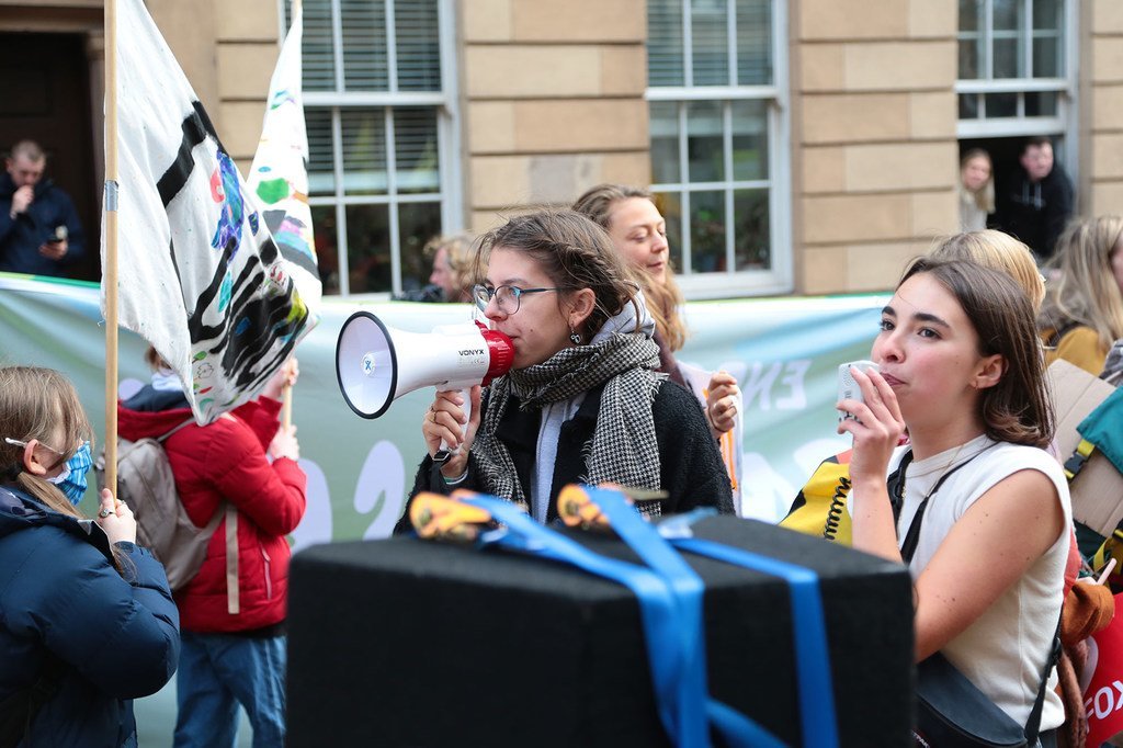 In Glasgow, Scotland, people take part in a Fridays for Future demonstration for climate action, led by youth climate activists and organized on the sidelines of the 2021 UN Climate Change Conference (COP26).