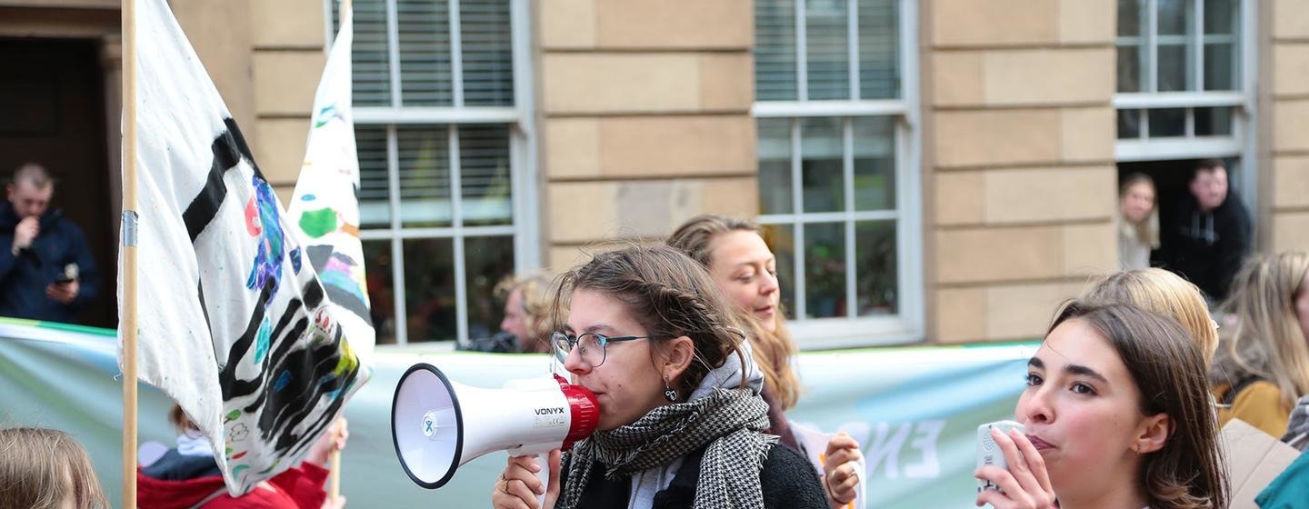 In Glasgow, Scotland, people take part in a Fridays for Future demonstration for climate action, led by youth climate activists and organized on the sidelines of the 2021 UN Climate Change Conference (COP26).