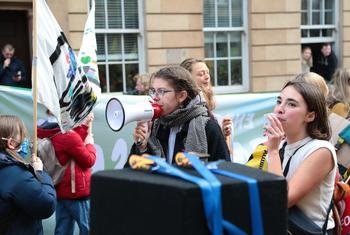 In Glasgow, Scotland, people take part in a Fridays for Future demonstration for climate action, led by youth climate activists and organized on the sidelines of the 2021 UN Climate Change Conference (COP26).