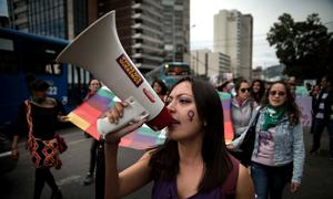 Activists attend a march against gender violence in Ecuador.