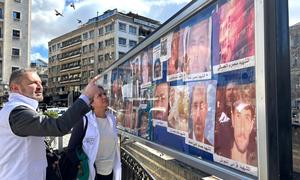 Karla Quintana (centre), head of the Independent Institution, visits Al Marjeh Square in Damascus, a place where families of missing persons display photos in hopes of finding their loved ones.