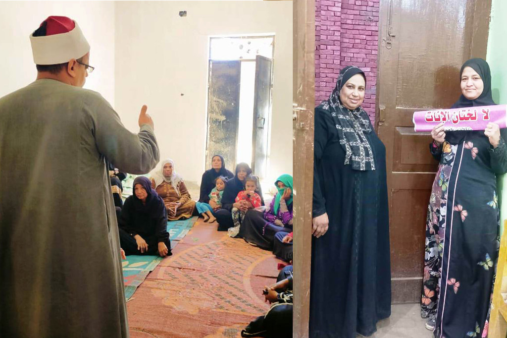 مثقفة صحية تتحدث إلى مجموعة من النساء والأطفال في مكان مجتمعي، بينما تقف امرأتان أخريان عند المدخل تحملان لافتة.