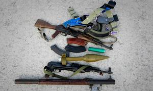 Weapons seized from suspected members of the Islamic insurgent group Al Shabaab are put on show in Mogadishu, Somalia.