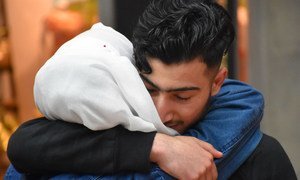 A Syrian teen is reunited with his family at an airport in Germany.