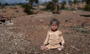 A young girl with  polio works in a mine in Anosy, Madagascar.