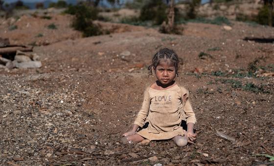 A young girl with  polio works in a mine in Anosy, Madagascar.