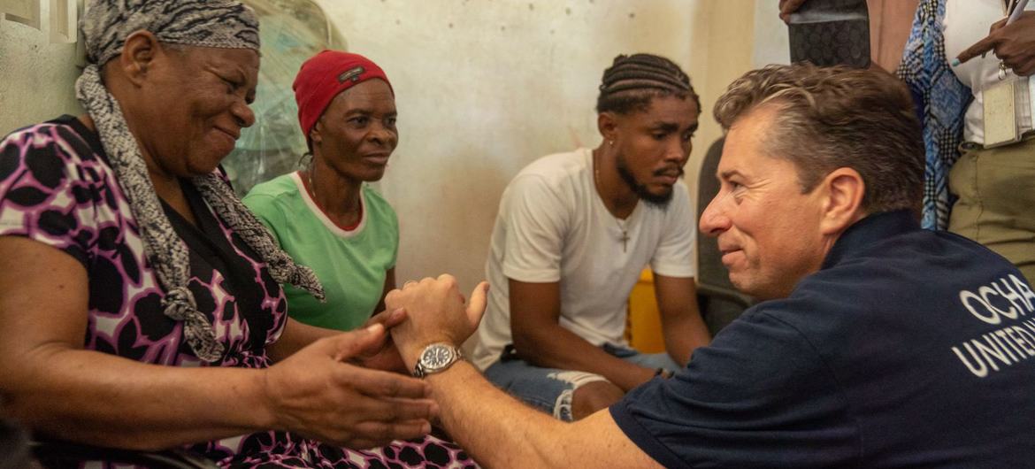 The UN's relief coordinator, Tom Fletcher, meets a family in Port-au-Prince, Haiti. The UN's relief coordinator, Tom Fletcher, meets a family in Port-au-Prince, Haiti.