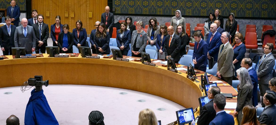 Members of the UN Security Council stand in silence to honour those affected by the Israel-Palestine conflict.