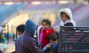 Children arrive with their families at a reception centre in Ar-Raqqa city, Syria.