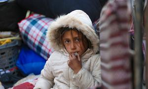 A girl who fled escalating violence in Aleppo with her family arrives at a reception centre in Ar-Raqqa city, Syria.