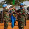 Kamanda Kikosi cha msaada wa haraka TanzQRF, Luteni Kanali David Nkungu (Kulia), akipokea bendera ya Tanzania kutoka kwa Kaimu kamanda kikosi cha msaada wa haraka TanzQRF, Meja Rafaeli Ngombale aliyemaliza muda wake kama ishara ya kukabidhiwa majukumu ra…