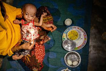 A malnourished child is fed at a shelter in a refugee settlement in Cox’s Bazar, Bangladesh.