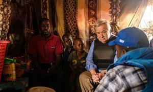 Secretary-General António Guterres meets a family of internally displaced people at a camp in Baidoa in southwestern Somalia.