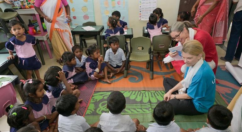 In India, UNICEF representative Cynthia McFree, while talking to children during the primary children's education session at Dibrugarh Deno Joy Tea Estate's Anganwadi Center. In India, UNICEF representative Cynthia McFree, while talking to children during the primary children's education session at Dibrugarh Deno Joy Tea Estate's Anganwadi Center.