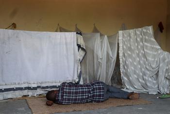 A displaced man rests in a community shelter in Bandundu, in the Democratic Republic of the Congo.