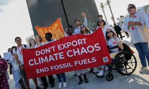 Youth activists protest at COP27 in Sharm El-Sheikh demanding leaders to address ending the use of fossil fuels.