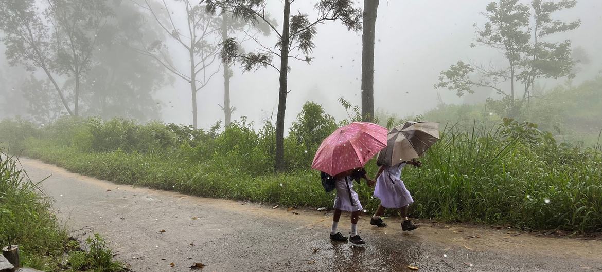 Students go home for lunch despite heavy rains that came early this year in Ramboda, Sri Lanka.