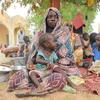 Mariam Djimé Adam, 33, is sitting in the yard of Adre’s secondary school in Chad. She arrived from Sudan with her 8 children. "We were attacked in our home, my husband was killed and all our belongings were taken. I managed to escape with my children