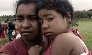 In Texas, USA, a woman hugs her four-year-old daughter after making the perilous journey through the Darien Gap between Colombia and Panama.