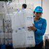 Staff prepare jerry cans for distribution at the UNICEF warehouse in Cox's Bazar ahead of Cyclone Mocha, which is expected to make landfall on 14 May.