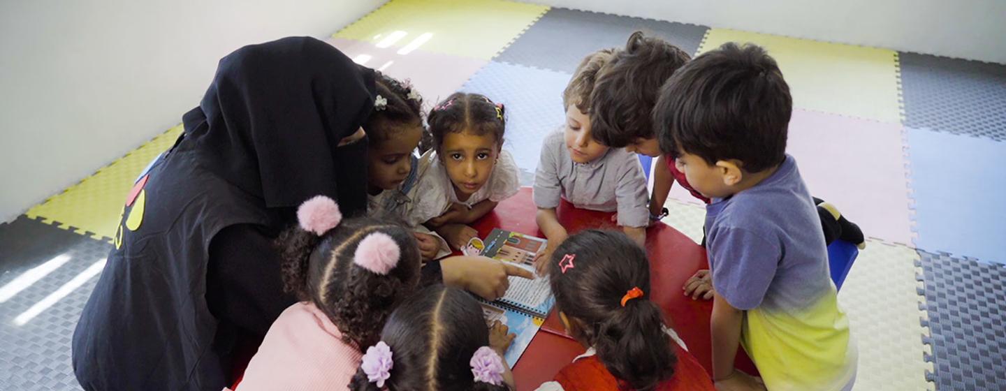 Children play with locally made educational toys in Yemen.