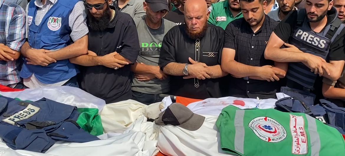 Mourners perform the funeral prayer for Palestinian journalists killed in an Israeli airstrike on August 10.