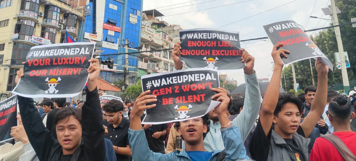 Young people protest in Kathmandu on Monday, holding signs denouncing corruption. Security forces responded with a violent crackdown, leaving more than 50 people dead in the ensuing crisis.