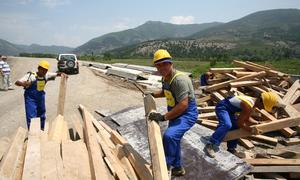 Men work on the construction of a new road in Albania.