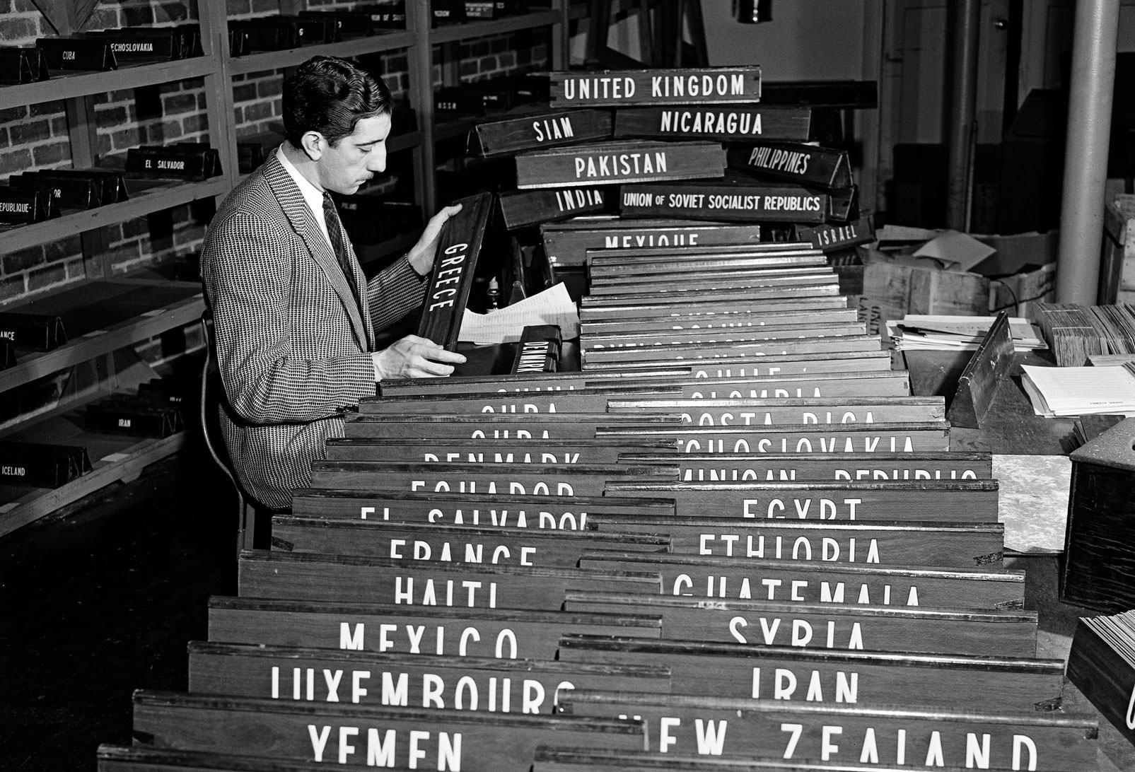 A UN staff member checks the nameplates for the countries participating in the UN General Assembly at Flushing Meadow. A UN staff member checks the nameplates for the countries participating in the UN General Assembly at Flushing Meadow.