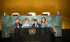 Make-a-Wish recipient Kale Ilac, and his family at the UN General Assembly Hall