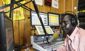 A journalist broadcasts at Radio Miraya in South Sudan.