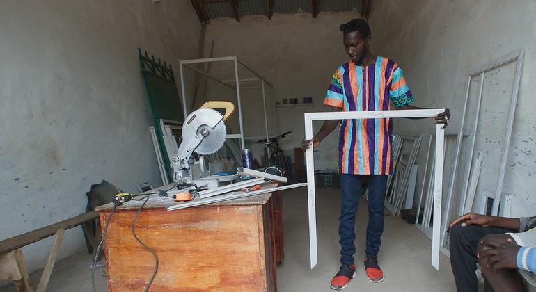 Amadou Jobe, a returning migrant, has found work in the Gambian capital, Banjul. Amadou Jobe, a returning migrant, has found work in the Gambian capital, Banjul.