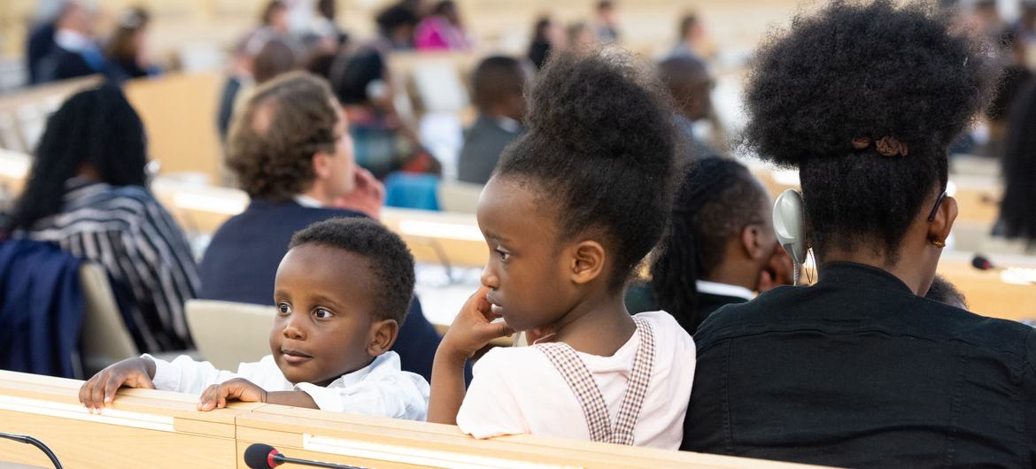 Two young participants during the Commemoration of the International Day of Reflection on the 1994 Genocide Against the Tutsi in Rwanda held in Geneva.