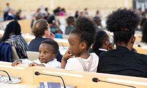 Two young participants during the Commemoration of the International Day of Reflection on the 1994 Genocide Against the Tutsi in Rwanda held in Geneva.