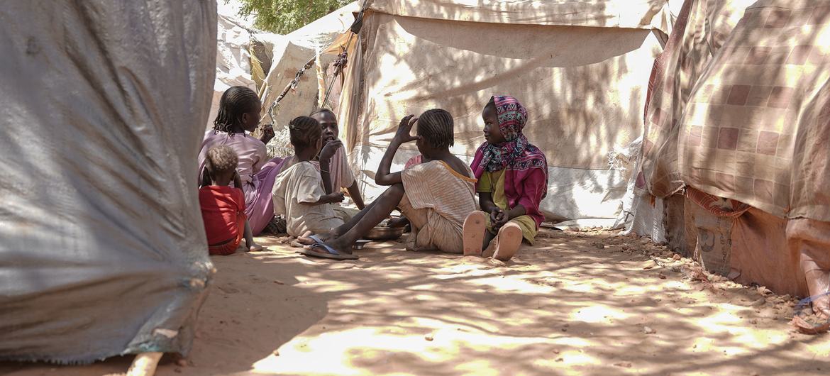 Children shelter in the shade in El Fasher, North Darfur.