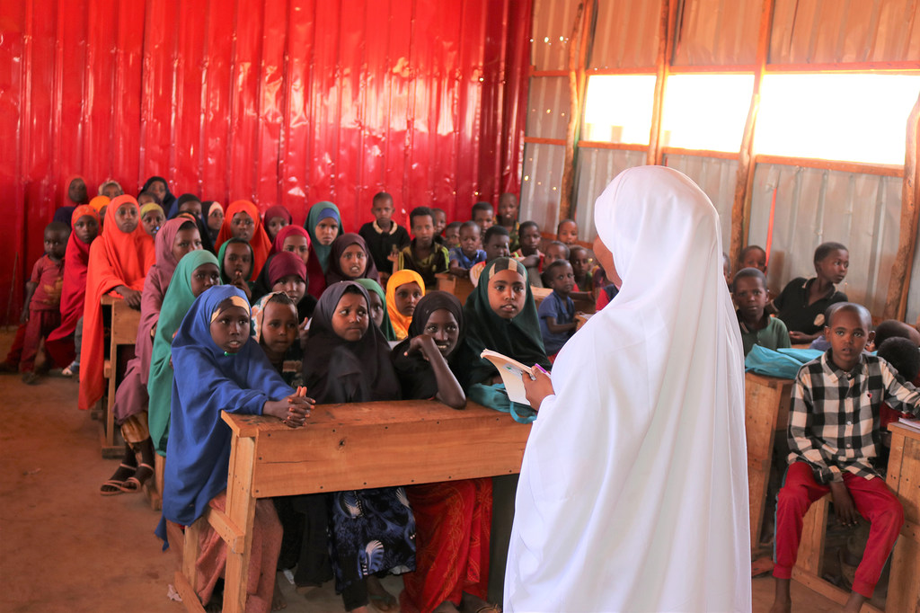 UNICEF teacher Sureer Farah teaches a class of children in a camp in Dollow, Somalia.