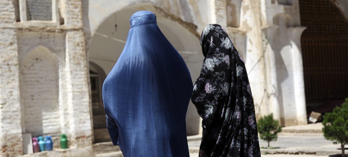 Two Afghan women  walk near an ancient mosque in western Herat province. 
